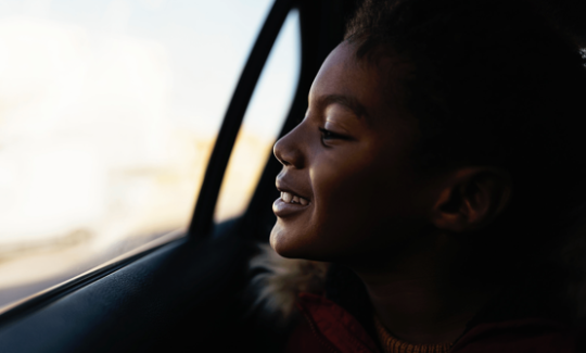 boy looking out car window